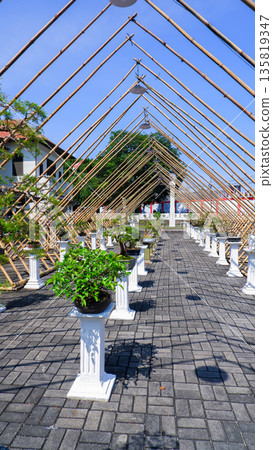 Perspective View of Bonsai Exhibition with Triangle Bamboo Frame Structure Perspective View of Bonsai Exhibition with Triangle Bamboo Frame Structure 135819347