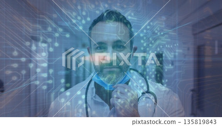Adjusting surgical mask doctor wearing lab coat, stethoscope in hospital corridor, digital overlay Adjusting surgical mask doctor wearing lab coat, stethoscope in hospital corridor, digital overlay 135819843