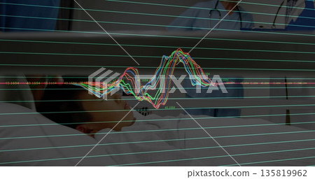 Medical team in scrubs reviewing boy patient at hospital bedside with waveform overlay, copy space 135819962