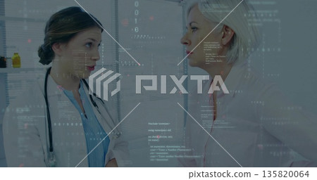 Reviewing digital data overlays doctor in white coat and patient in exam room, with stethoscope Reviewing digital data overlays doctor in white coat and patient in exam room, with stethoscope 135820064