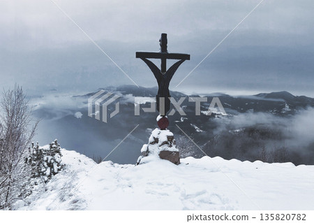 Cross of Jesus Christ on top of a mountain with snow Cross of Jesus Christ on top of a mountain with snow 135820782