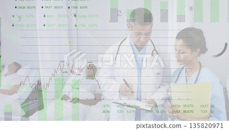 Two medical staff reviewing clipboard and yellow file by hospital bed, with financial data overlays 135820971