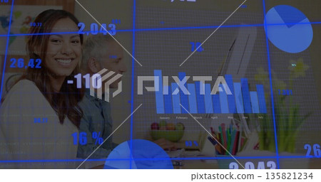 Woman wearing blouse typing on keyboard while viewing chart on monitor in modern office, copy space 135821234