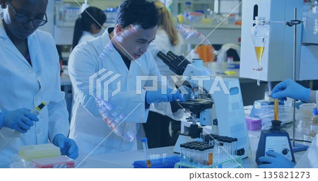 Operating researcher wearing lab coat and gloves adjusting microscope slide in lab with test tube 135821273