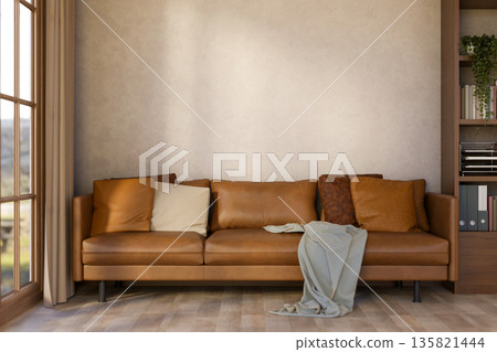 Brown leather sofa with cushions and blanket aside wooden bookshelf on parquet floor in living room. Brown leather sofa with cushions and blanket aside wooden bookshelf on parquet floor in living room. 135821444