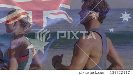 Woman and man in athletic tops running on beach, with wrist trackers and Australian flag overlay Woman and man in athletic tops running on beach, with wrist trackers and Australian flag overlay 135822117