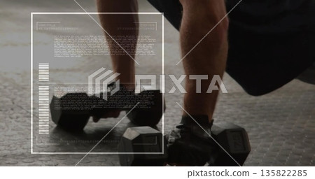Performing fit athlete gripping hex dumbbells in low plank on gym floor, with technical overlay Performing fit athlete gripping hex dumbbells in low plank on gym floor, with technical overlay 135822285
