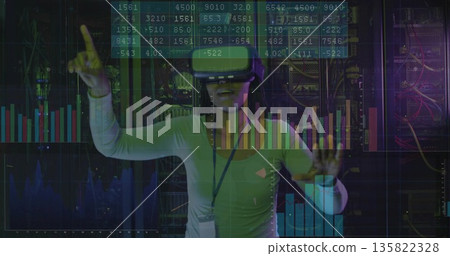 Interacting woman wearing VR headset exploring digital overlays in data center, with server racks Interacting woman wearing VR headset exploring digital overlays in data center, with server racks 135822328
