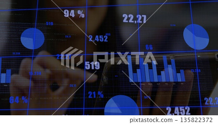 Interacting data analyst wearing jacket tapping touchscreen display in office, with floating charts 135822372