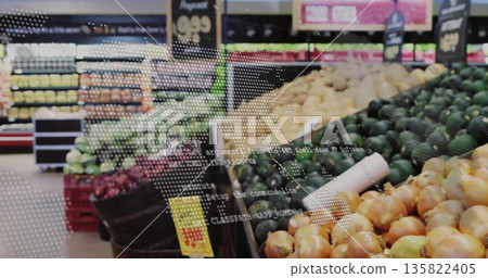 Wooden and plastic bins showcasing onions and avocados in grocery aisle, code overlay projection 135822405