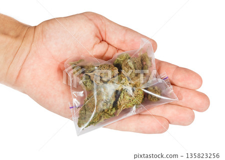Man trading marijuana isolated on a white background 135823256