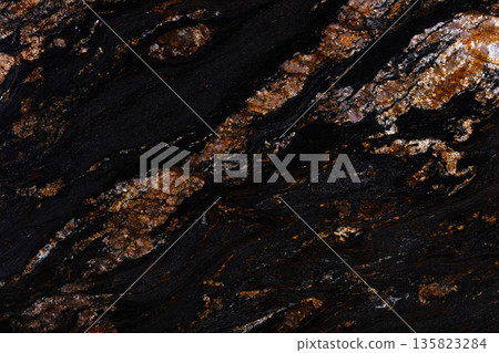 Black Magma granite background in natural dark color. Black Magma granite background in natural dark color. 135823284