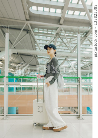 A woman leaving the airport for a trip (Photo courtesy of Kansai International Airport (KIX)) A woman leaving the airport for a trip (Photo courtesy of Kansai International Airport (KIX)) 135823385