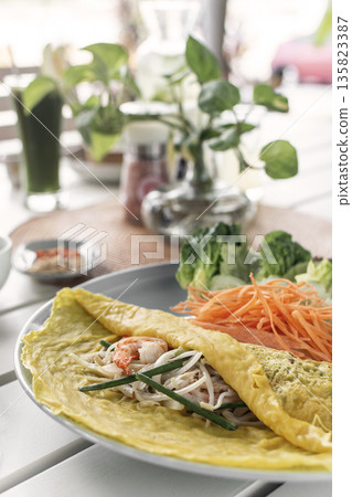 Banh xeo vietnamese traditional food pancake crepe with pork and salad in Vietnam Banh xeo vietnamese traditional food pancake crepe with pork and salad in Vietnam 135823387