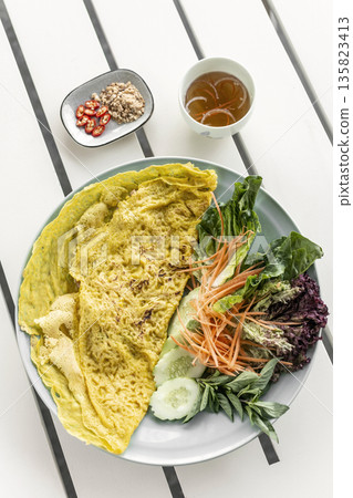 Banh xeo vietnamese traditional food pancake crepe with pork and salad in Vietnam 135823413