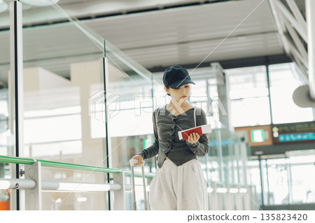 A woman leaving the airport for a trip (Photo courtesy of Kansai International Airport (KIX)) A woman leaving the airport for a trip (Photo courtesy of Kansai International Airport (KIX)) 135823420