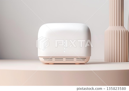 A smart home device is placed on a flat surface in a modern indoor setting with soft lighting. The device has a simple design with button indicators visible on the front 135823580