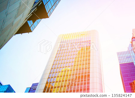 Skyscrapers bright glass exteriors sunlight on sunset. Facade office buildings in China, Hong Kong 135824147
