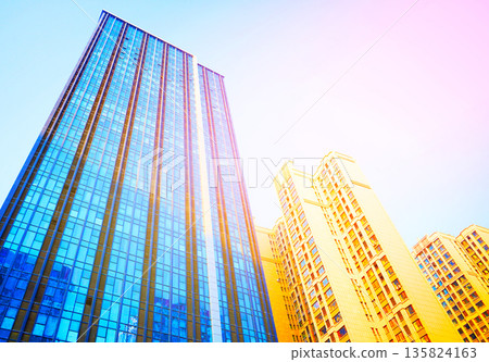Skyscrapers bright glass exteriors sunlight on sunset. Facade office buildings in China, Hong Kong 135824163