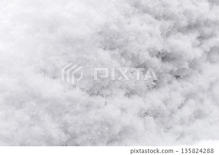 Snow blankets the ground, creating a thick layer of white fluff. Sunlight shines on the snow, making it glisten during a winter day in an outdoor area Snow blankets the ground, creating a thick layer of white fluff. Sunlight shines on the snow, making it glisten during a winter day in an outdoor area 135824288