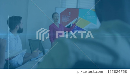 Presenting woman wearing blouse explaining infographic on screen in conference room with notebooks 135824768