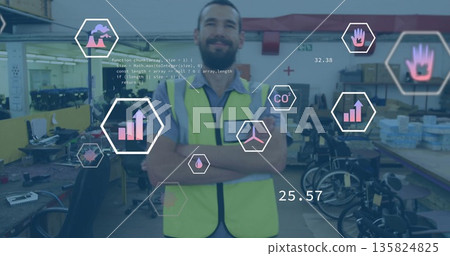 Crossing arms adult male wearing safety vest in workshop, with monitors, wheelchairs and AR icons Crossing arms adult male wearing safety vest in workshop, with monitors, wheelchairs and AR icons 135824825