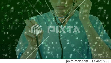 Showing doctor wearing teal scrubs holding stethoscope toward viewer in studio, with data overlay Showing doctor wearing teal scrubs holding stethoscope toward viewer in studio, with data overlay 135824885