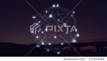 Floating holographic network sphere over sea pier with lampposts at dusk showing social media icons 135824908