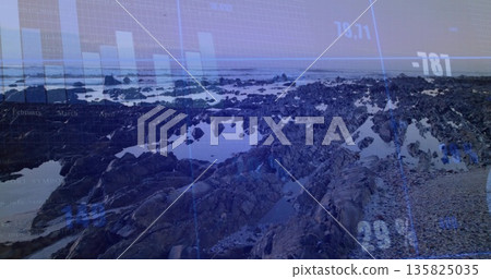 Displaying jagged rocky shoreline exposing tidal pools at low tide, with digital data overlay 135825035