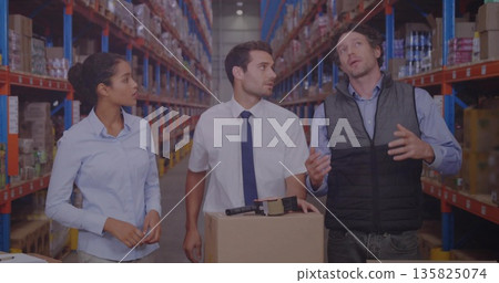 Labeling cardboard boxes at workstation, team in business attire in warehouse aisle using label gun Labeling cardboard boxes at workstation, team in business attire in warehouse aisle using label gun 135825074