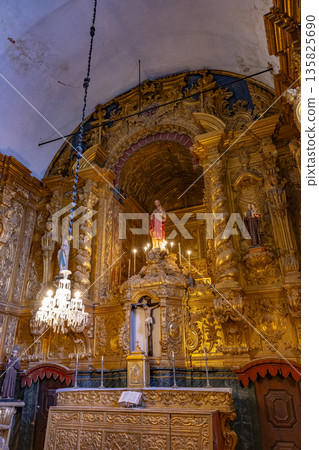 Ornate golden baroque altar inside church in Beja, Portugal Ornate golden baroque altar inside church in Beja, Portugal 135825690