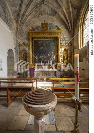 Ancient church interior Arles featuring baptismal font and altar Ancient church interior Arles featuring baptismal font and altar 135825693
