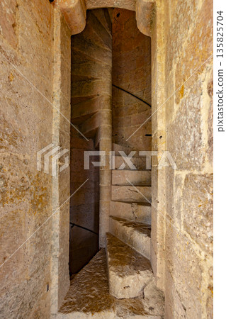 Old stone spiral staircase in La Romieu, France Old stone spiral staircase in La Romieu, France 135825704