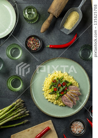 Roasted duck breast with couscous and asparagus meal Roasted duck breast with couscous and asparagus meal 135825708
