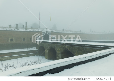 Mala Pevnost fortress in Terezin on a foggy winter day Mala Pevnost fortress in Terezin on a foggy winter day 135825721