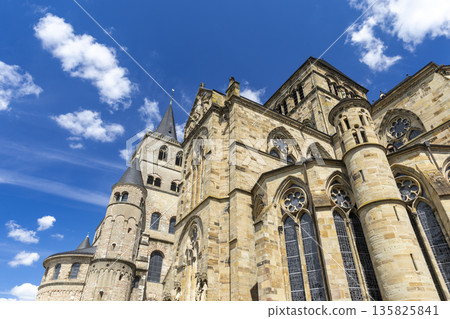 Trier Cathedral showing historic Romanesque architecture against blue sky 135825841