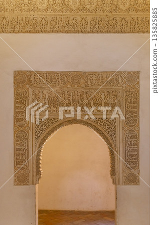 Ornate archway with Arabic calligraphy, Alhambra, Granada, Spain 135825885