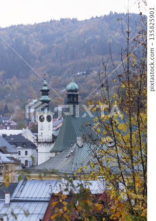 Banska Stiavnica townscape showing baroque church in autumn Banska Stiavnica townscape showing baroque church in autumn 135825901