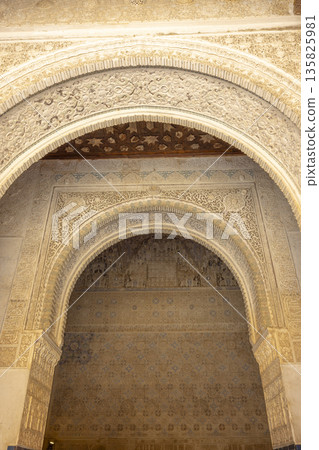 Elaborate Moorish architecture in Alhambra Palace, Granada, Spain 135825981