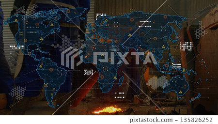 Displaying digital world map overlay with hazard data markers over molten metal on workshop floor Displaying digital world map overlay with hazard data markers over molten metal on workshop floor 135826252