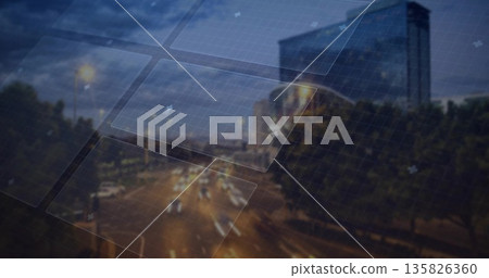 Projecting grid panels overlaying nighttime street, with light trails, trees and glass building Projecting grid panels overlaying nighttime street, with light trails, trees and glass building 135826360