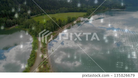 Traversing winding unpaved road along lake shoreline overhead in lakeside area, with binary code 135826679