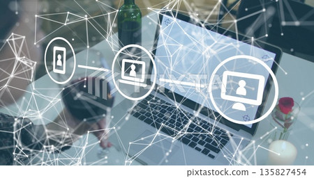 Checkered shirt woman interacting with virtual overlay in office, with laptop, bottle, rose, candle 135827454