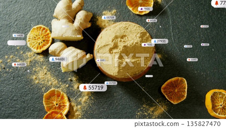 Ginger powder bowl sitting in studio with ginger root, dried citrus, floating notification badges Ginger powder bowl sitting in studio with ginger root, dried citrus, floating notification badges 135827470