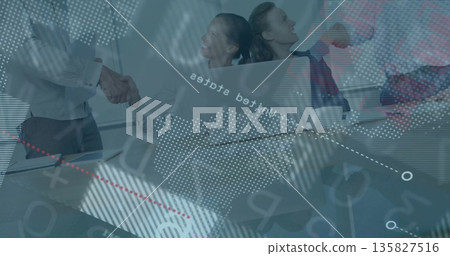 Office colleagues in business attire shaking hands in glass meeting room, with world-map overlay Office colleagues in business attire shaking hands in glass meeting room, with world-map overlay 135827516