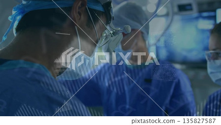 Performing surgery surgeon in blue scrubs leaning over drape with instruments in OR, copy space Performing surgery surgeon in blue scrubs leaning over drape with instruments in OR, copy space 135827587