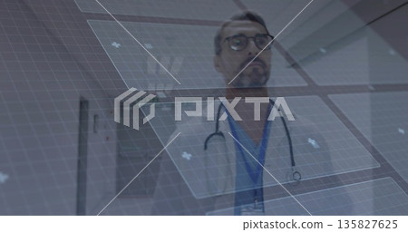 Physician analyzing holographic panels in hospital corridor, with lab coat stethoscope eyeglasses Physician analyzing holographic panels in hospital corridor, with lab coat stethoscope eyeglasses 135827625
