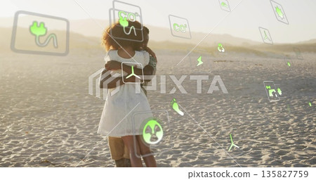 Couple embracing in dunes at golden hour wearing sleeveless white dress amid floating eco icons Couple embracing in dunes at golden hour wearing sleeveless white dress amid floating eco icons 135827759
