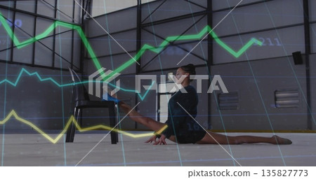 Stretching woman in activewear doing side split on gym floor, with black chair and graph overlays Stretching woman in activewear doing side split on gym floor, with black chair and graph overlays 135827773
