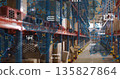 Warehouse aisle showing boxes on pallet racks in distribution center, with bollards and map overlay 135827864